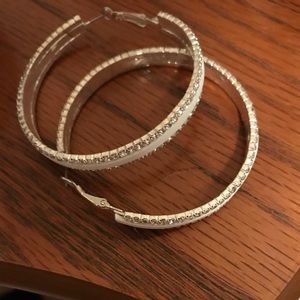 Large white hoop earrings with rhinestones